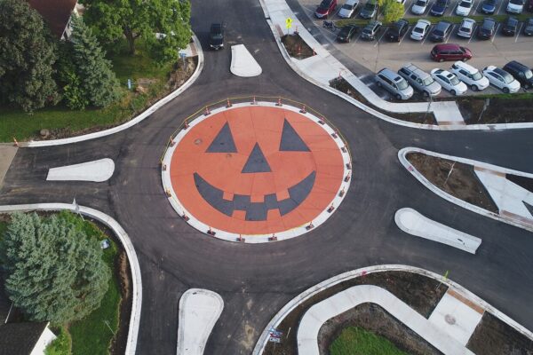 Overview of a traffic circle featuring a pumpkin