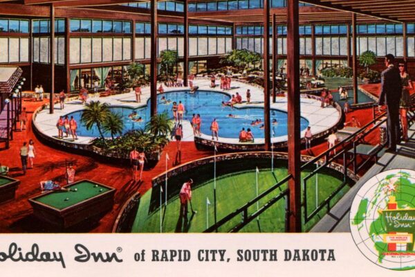 Postcard image of a Holiday Inn hotel in Rapid City South Dakota