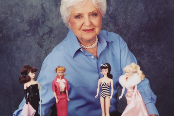 Image of the creator of Barbie Dolls with four favorite original dolls