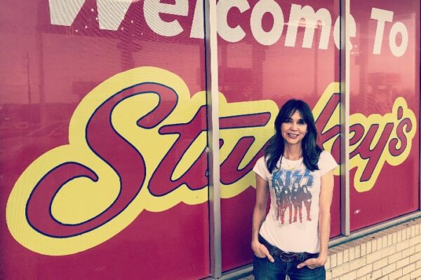Stephanie Stuckey in front of a Stuckey's logo at a licensed location
