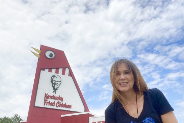 Image of Stephanie Stuckey in front of a KFC.