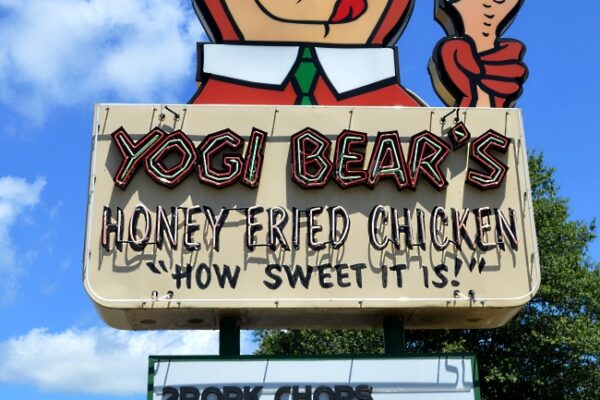 Image of outdoor sign for Yogi Bear Honey Fried Chicken restaurant.