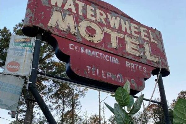 Water Wheel Motel Sign Image promotional advertising picture