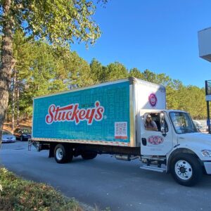 Photo of new Stuckey's delivery truck with CEO Stephanie Stuckey hanging out the passenger's side window.