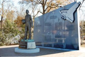 Photo of Dr. Ronald McNair Memorial including statue and granite wall.