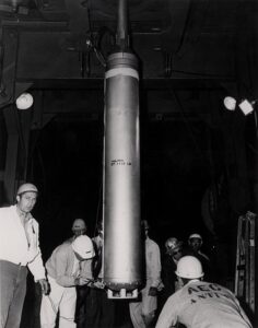 Picture showing the test bomb before being lowered into ground near Baxterville, Mississippi.