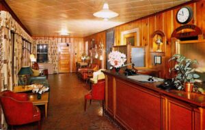Postcard picture of the interior lobby of the Whispering Pines Motel.
