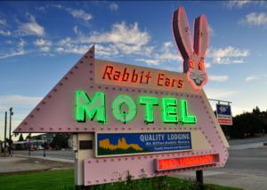 The Rabbit Ears Motel sign at night.