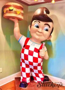 Statue of Big Boy holding a burger and a Stuckey's Pecan log Roll in the Stuckey's retail office in wrens, Georgia.