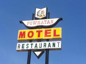 Photo of sign reading Powhatan Motel and Restaurant.