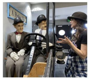 CEO of Stuckey's, Stephanie Stuckey, having a chat with Stan and Ollie at the Laurel and Hardy Museum.