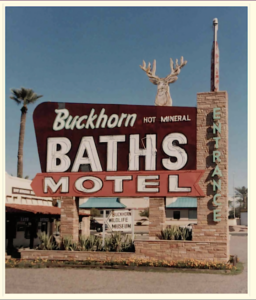 Photographof the Buckhorn Baths Motel Sign.